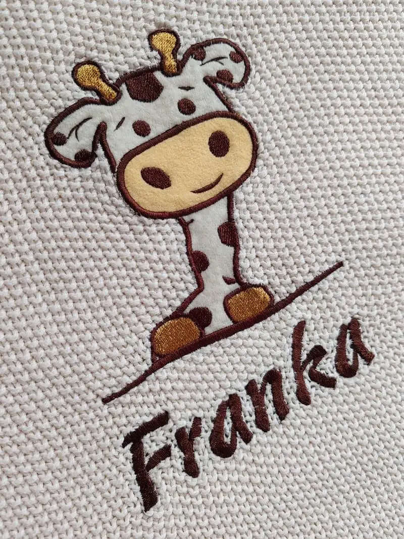 Machine embroidery on a cotton blanket