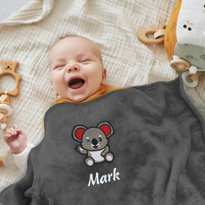 Child with dark gray personalized blanket